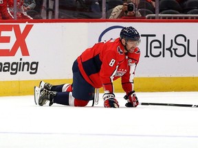 Capitals captain Alex Ovechkin gets up slowly against the Flyers in the first period of a preseason game at Capital One Arena in Washington, D.C., Friday, Oct. 8, 2021.