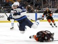 Jets forward Andrew Copp leaps over Anaheim Ducks’ Simon Benoit during their game on Oct. 26 at the Honda Center. Entering last night’s game against the San Jose Sharks, Copp had racked up an impressive five goals and nine points in seven games.  Sean M. Haffey/Getty Images