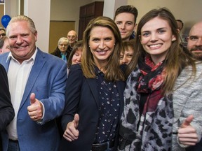 Doug Ford, Caroline Mulroney, centre, and Lindsey Park are pictured at the official opening of the campaign office for Ajax Ontario PC candidate Rod Phillips in Ajax, Ont. on Saturday, March 24, 2018.