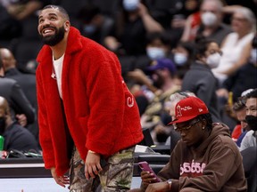 Drake attends a preseason NBA game between the Toronto Raptors and the Houston Rockets on Oct. 11, 2021.