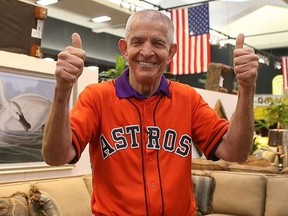 Jim ‘Mattress Mack’ McIngvale in an Astros jersey giving two thumbs up.