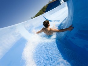 Man going down water slide