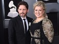Kelly Clarkson and Brandon Blackstock arrive for the 60th Grammy Awards in New York City, Jan. 28, 2018.