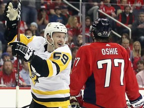 Jake Guentzel of the Pittsburgh Penguins celebrates his game winning goal at 7:48 of the third period against the Washington Capitals in Game 1 of the Eastern Conference Second Round during the 2018 NHL Stanley Cup Playoffs at the Capital One Arena on April 26, 2018 in Washington, D.C.