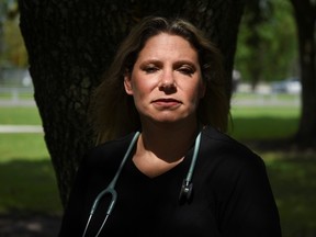Jennifer Bridges, 39, an RN who was fired from her job after refusing the COVID-19 vaccine, poses for a portrait at Jenkins Park in Baytown, Texas, Sept. 30, 2021.