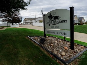 A sign marks the entrance of the home office of Christian Aid Ministries in Millersburg, Ohio, October 17, 2021.