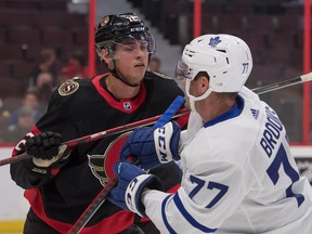 Ottawa Senators centre Shane Pinto (12) battles Toronto Maple Leafs centre Adam Brooks in the first period on Monday night at the Canadian Tire Centre.