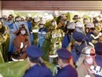 Rescue workers and police officers work at the site where a knife, arson and acid attack incident occurred on a train, at the Kokuryo station of the Keio Line train in Tokyo, Japan, Oct. 31, 2021 in this photo taken by Kyodo.