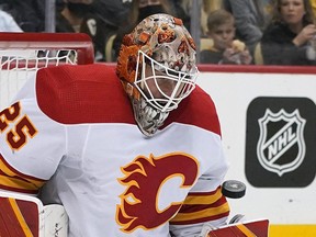 Calgary Flames goaltender Jacob Markstrom blocks a shot during the second period of the team's NHL hockey game against the Penguins in Pittsburgh on Thursday. Markstrom finished with a 45-save shutout.