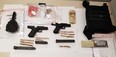 Toronto Police officers arrested three men and discovered a number of handguns -- including two Glock 9mm pistols with over-capacity extended magazines -- as well as a drum magazine, ammunition and a quantity of drugs and cash while executing a search warrant in the city on July 12, 2021.