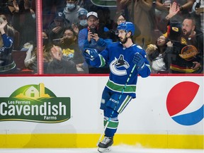 Vancouver Canucks forward Nic Petan (7) celebrates his goal against the Winnipeg Jets in the second period at Rogers Arena, Oct. 3, 2021.