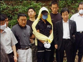 South Korean detectives with the Raincoat Killer.