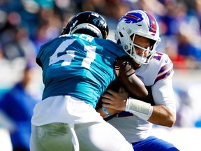 Jacksonville Jaguars outside linebacker Josh Allen sacks Buffalo Bills quarterback Josh Allen.