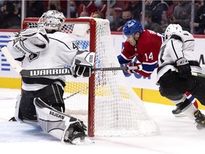 Los Angeles Kings defenceman Tobias Bjornfot chases Montreal Canadiens centre Nick Suzuki as he attempts a wrap-around on goaltender Cal Petersen in Montreal, on Nov. 9, 2021. Suzuki hit the post on the play.