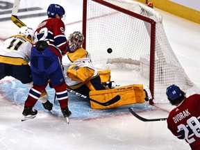 Habs centre Christian Dvorak (28) scores on Nashville Predators goaltender Juuse Saros during the second period at the Bell Centre on Saturday, Nov. 21, 2021.