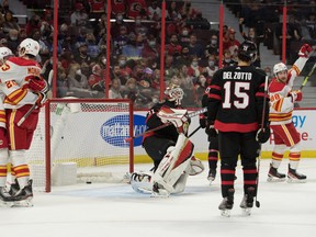 Flames celebrate a goal scored by Andrew Mangiapane (right) against the Senators at the CTC last night.