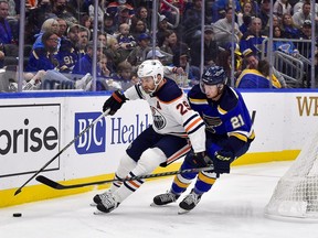 Edmonton Oilers center Leon Draisaitl (29) handles the puck as St. Louis Blues center Tyler Bozak (21) defends during the second period at Enterprise Center on Nov. 14, 2021.