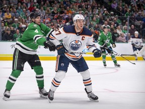 Dallas Stars defenseman Miro Heiskanen (4) defends against Edmonton Oilers center Connor McDavid (97) during the first period at the American Airlines Center on Nov. 23, 2021.