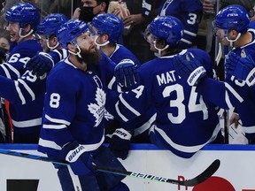 Toronto Maple Leafs defenceman Jake Muzzin (8) celebrates his goal against the Detroit Red Wings during first period NHL hockey action in Toronto on Saturday, October 30, 2021.