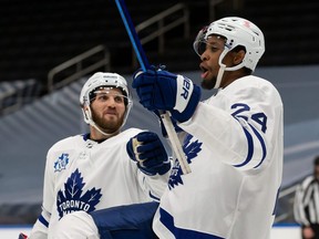 Both Hockey Diversity Alliance leader Wayne Simmonds (right) and Maple Leafs player rep Alexander Kerfoot (left) say the team has been united in its determination to make sure the what Kyle Beach went through never happens again