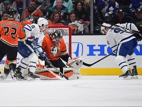Anaheim Ducks goaltender John Gibson blocks a shot against Toronto Maple Leafs centre John Tavares, right, during the first period at Honda Center in Anaheim, Calif., Nov. 28, 2021.