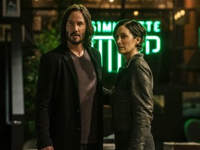 Keanu Reeves and Carrie-Anne Moss in a scene from The Matrix Resurrections.