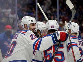 New York Rangers left wing Chris Kreider celebrates his goal against the New York Islanders with teammates during the third period at UBS Arena in Elmont, N.Y., Nov. 24, 2021.