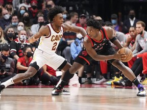 Raptors' OG Anunoby, right, is guarded by Cavaliers' Collin Sexton during first half NBA action at Scotiabank Arena in Toronto, Friday, Nov. 5, 2021.
