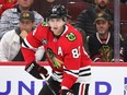 Patrick Kane of the Chicago Blackhawks looks to pass against the Vancouver Canucks at United Center on Oct. 21, 2021 in Chicago.