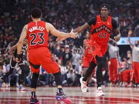 Fred VanVleet #23 celebrates with Pascal Siakam #43 of the Raptors during the first half of their NBA game against the Nets at Scotiabank Arena in Toronto, Sunday, Nov. 7, 2021.