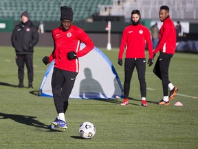 Alphonso Davies kicks a ball during warm up at the Canadian Men's national football squad practice ahead of FIFA World Cup 2022 qualifying game with Costa Rica on Friday. Taken on Wednesday, Nov. 10, 2021 at Commonwealth Stadium in Edmonton.