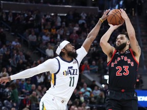 Toronto Raptors guard Fred VanVleet (23) take a shot defended by Utah Jazz guard Mike Conley (11) during the first quarter at Vivint Arena on Nov. 18, 2021.