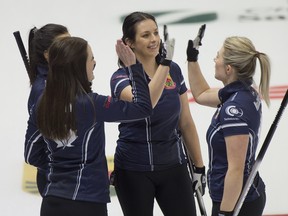 Team Fleury (L-R), Selena Njegovan, skip Tracy Fleury, Liz Fyfe and Kristin MacCuish of East St. Paul, Man. celebrate after defeating Team Walker 11-7, to remain undefeated at the Canadian Curling Trials in Saskatoon.