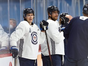The Jets are 6-3-3 despite the fact that offensive lynchpins Mark Scheifele (left) and Blake Wheeler have combined for zero goals.