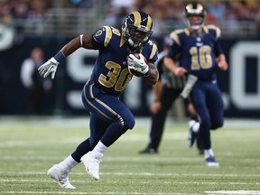 Zac Stacy of the St. Louis Rams rushes against the Chicago Bears at the Edward Jones Dome on November 24, 2013 in St. Louis, Missouri.