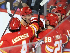 The Calgary Flames celebrate a Johnny Gaudreau on New York Rangers goaltender Igor Shesterkin during NHL action in Calgary on Saturday, November 6, 2021.