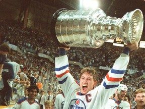 Wayne Gretzky lifting the Stanley Cup while with the Edmonton Oilers.