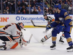 Edmonton Oilers goaltender Stuart Skinner (74) makes a save on Buffalo Sabres left wing Vinnie Hinostroza (29) during the second period at KeyBank Center.