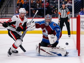 Ottawa Senators centre Colin White (36) tries to get a shot past Colorado Avalanche goaltender Philipp Grubauer (31), Feb. 11, 2020.