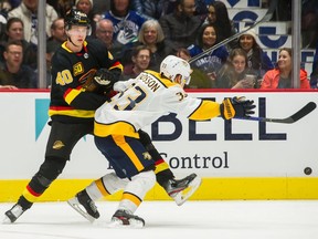 Canucks star Elias Pettersson (left), who last got such personal attention from the Nashville Predators in a Feb. 10, 2020 NHL game at Rogers Arena — a Canucks’ 6-2 win, to boot — has looked much better of late in his play, which he must hope to continue into Friday’s home-ice reunion date against the Preds.