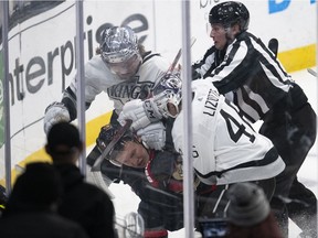 Ottawa Senators left-winger Brady Tkachuk (7) gets into a brawl with Los Angeles Kings left-winger Brendan Lemieux (48) and centre Blake Lizotte (46) in the third period of an NHL hockey game Saturday, Nov. 27, 2021, in Los Angeles.