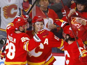 Calgary Flames forward Matthew Tkachuk celebrates his game-winner in the third period of Tuesday night's game against the Chicago Blackhawks at the Scotiabank Saddledome.