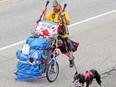 In this file photo, Michael Yellowlees and Luna are pictured heading west of North Bay as they continued their cross-Canada journey.