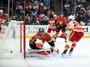 The Calgary Flames’ Blake Coleman scores a goal against Anaheim Ducks goaltender John Gibson at Honda Center in Anaheim, Calif., on Friday, Dec. 3, 2021.