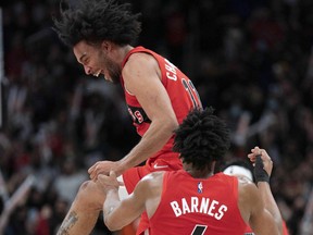 Toronto Raptors forward Justin Champagnie celebrates at the end of the fourth quarter against the Oklahoma City Thunder.