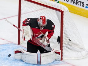 Team Canada’s goalie Dylan Garand (31) makes a save on Team Russia during second period of IIHF World Junior Championship exhibition play at Rogers Place in Edmonton, on Thursday, Dec. 23, 2021.