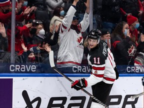 Team Canada’s Cole Perfetti (11) celebrates teammate Donovan Sebrango’s (7) goal on Team Czechia’s goaltender Jakub Malek (1) during first period IIHF World Junior Championship action at Rogers Place in Edmonton, on Sunday, Dec. 26, 2021.