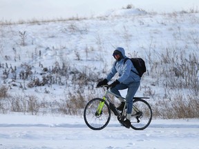 A cyclist braves bone chilling temperatures on a trail near the University District in northwest Calgary on Sunday, December 26, 2021. Extrremely cold temperatures will be in the area for the rest of the week.