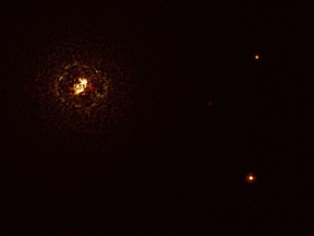 This handout photo released on Dec. 8, 2021 by the European Southern Observatory shows the most massive planet-hosting star pair to date, b Centauri, and its giant planet b Centauri b.