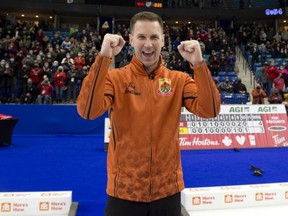 Skip Brad Gushue celebrates after defeating Brad Jacobs 4-3 to capture the men's Olympic curling trials in Saskatoon, Nov. 28, 2021.